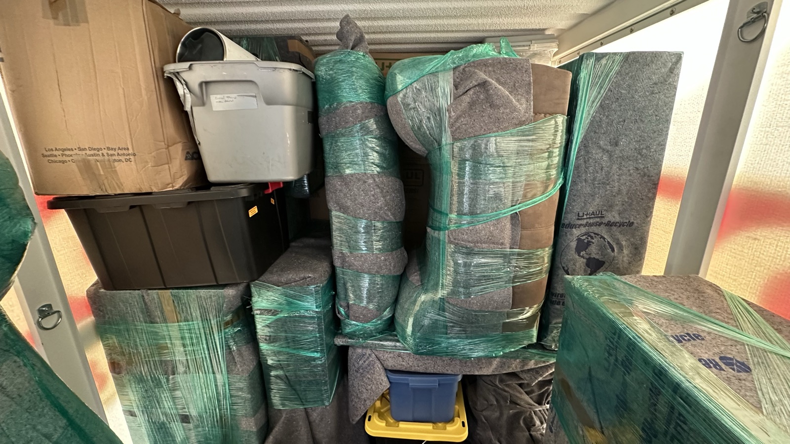 Blanket-wrapped furniture loaded inside a moving truck by I&O Moving Smiths crew in Baltimore, MD